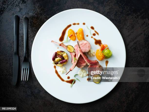 rack of lamb with eggplant stew and tzatziki froth - chuleta fotografías e imágenes de stock