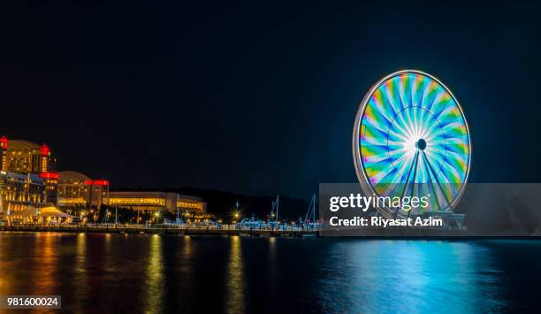 evening at national harbor - national harbor ferris wheel stock pictures, royalty-free photos & images