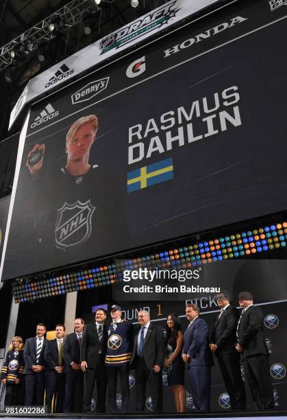 Rasmus Dahlin poses for a photo onstage after being selected first overall by the Buffalo Sabres during the first round of the 2018 NHL Draft at...