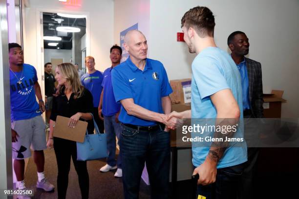 Head Coach Rick Carlisle exchanges handshakes with Draft Pick Luka Doncic prior to the Post NBA Draft press conference on June 22, 2018 at the...