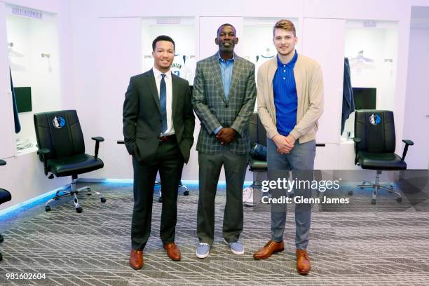 Draft Picks Jalen Brunson and Luka Doncic pose for a portrait with Michael Finley at the Post NBA Draft press conference on June 22, 2018 at the...