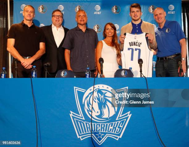 Donnie Nelson Draft Pick Luka Doncic and his mother along with Dallas Mavericks Head Coach Rick Carlisle pose for a photo at the Post NBA Draft press...