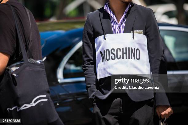 Fashion detail of Moschino bag, is seen in the streets of Paris after the Juun.J show, during Paris Men's Fashion Week Spring/Summer 2019 on June 22,...