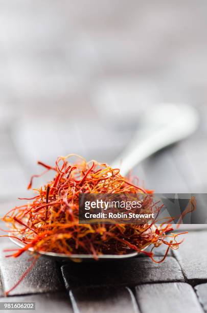 close-up of saffron in spoon, spain - saffron stock pictures, royalty-free photos & images