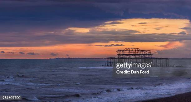 west pier orange sunset - west orange stockfoto's en -beelden