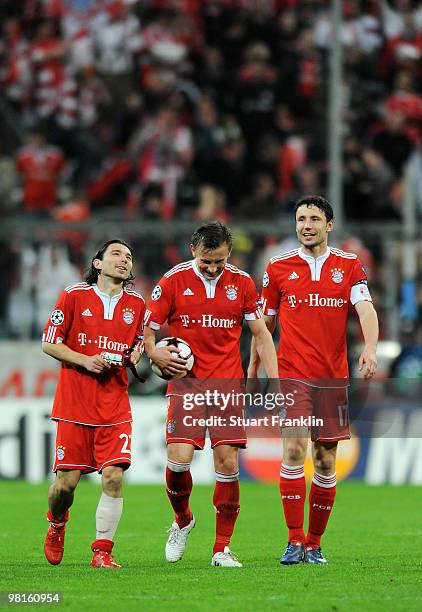 Ivica Olic of Bayern celebrates with Danijel Pranjic and Mark van Bommel at the end of the UEFA Champions League quarter final, first leg match...