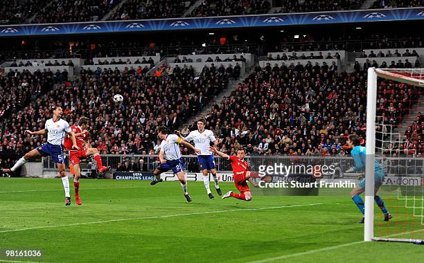 Thomas Mueller of Bayern has a shot stopped by Rio Ferdinand of Manchester during the UEFA Champions League quarter final, first leg match between FC...