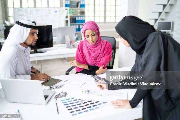 coworkers discussing and planning at workplace - tailor stock pictures, royalty-free photos & images