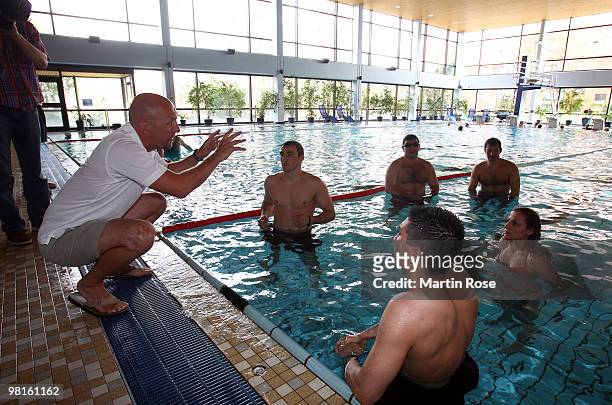 Dirk Lange , head coach of the German national swimming team talks to Eduard Gutknecht, Ruslan Chagaev, Dimitri Sartison, Susi Kentikian and Igor...