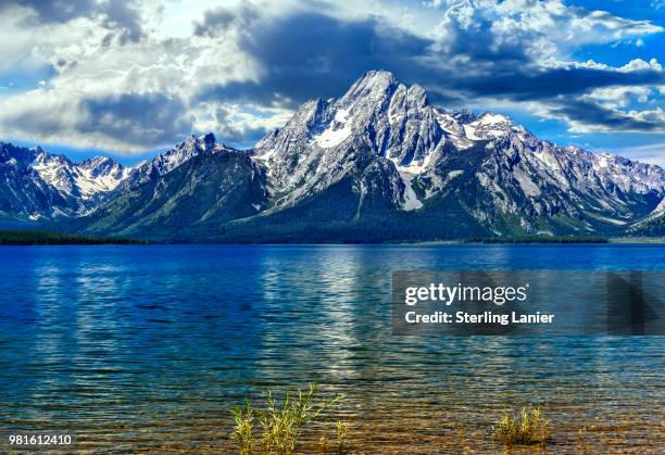 grand teton range from colter bay wyoming - colter bay stock pictures, royalty-free photos & images