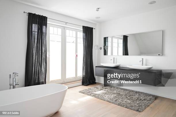spacious modern bathroom - domestic bathroom stock pictures, royalty-free photos & images
