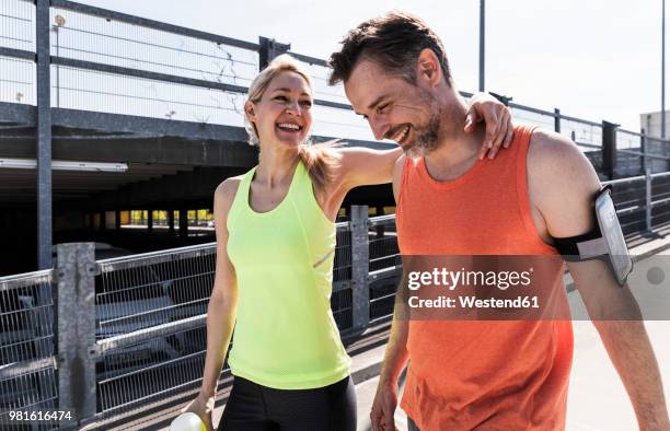 fit couple jogging in the city, having fun, taking a break - 40 49 år bildbanksfoton och bilder