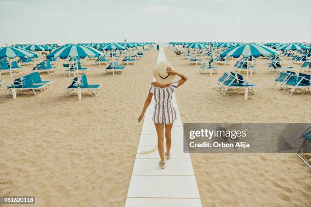 young woman at italian beach - rimini stock pictures, royalty-free photos & images
