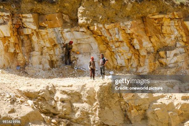 Tajikistan. On the other side of the river you can see how the Afghani side of the road with hand tools is built.