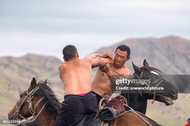 Kyrgyzstan. Issyk-Kul region. Ak Say. Wrestling on horseback. Nomad Games.