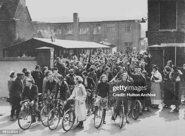 Workers leaving the KLG spark plug factory in Putney Vale, London, 1937.