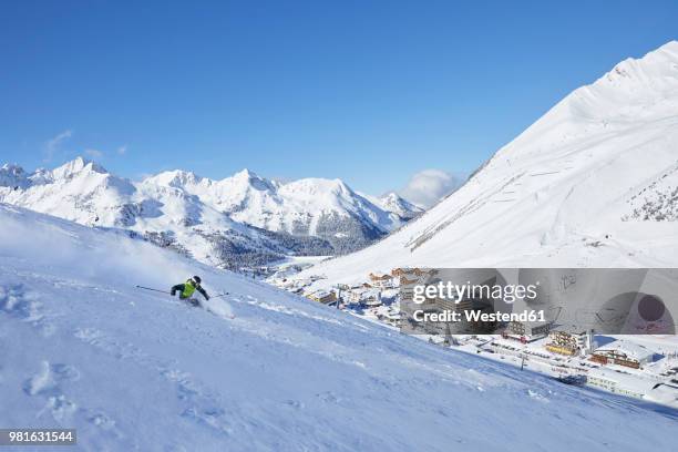 austria, tyrol, kuehtai, man skiing in winter landscape - estado do tirol imagens e fotografias de stock