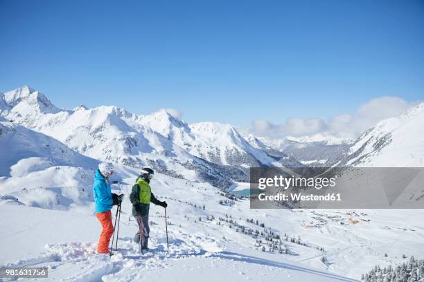 austria, tyrol, kuehtai, two skiers in winter landscape - sunday in the valley stock pictures, royalty-free photos & images