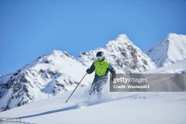 austria, tyrol, kuehtai, man skiing in winter landscape - estado do tirol imagens e fotografias de stock