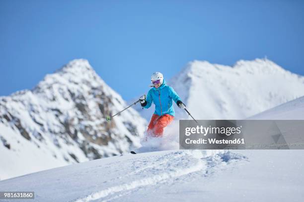 austria, tyrol, kuehtai, woman skiing in winter landscape - kühtai stock-fotos und bilder