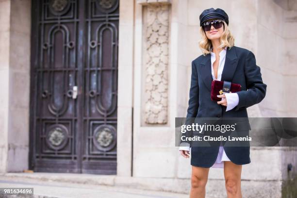 Xenia Adonts Overdose, wearing long jacket and Prada bag, is seen in the streets of Paris before the Cerruti 1881 show, during Paris Men's Fashion...