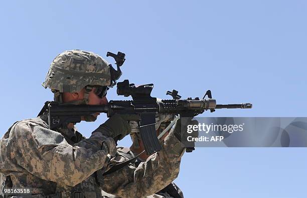 Soldier takes position during a patrol in the Sar Hawza district of Paktika province on March 31, 2010. A bomb attack in a crowded market in southern...