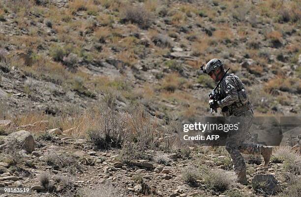 Soldier takes part in a patrol in the Sar Hawza district of Paktika province on March 31, 2010. A bomb attack in a crowded market in southern...