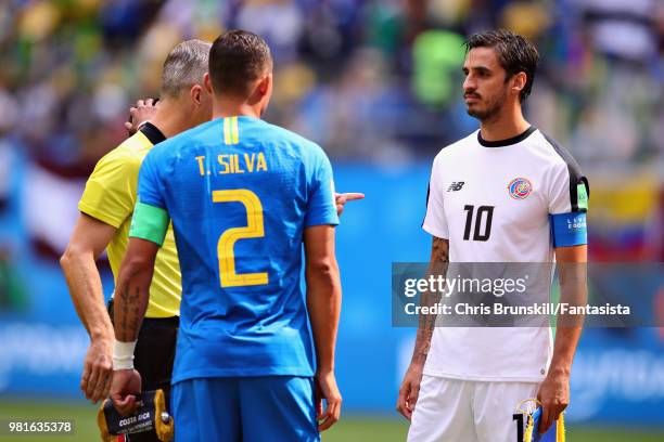 Thiago Silva of Brazil, Referee Bjorn Kuipers and Bryan Ruiz of Costa Rica talk before the 2018 FIFA World Cup Russia group E match between Brazil...