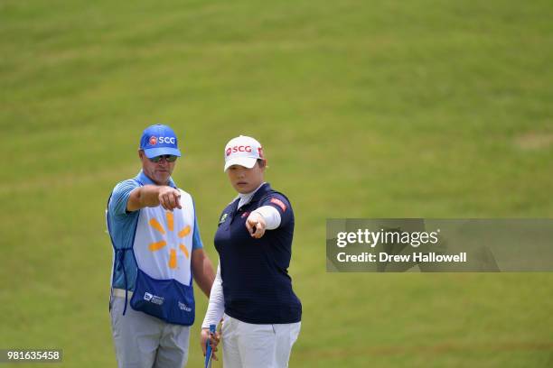 Ariya Jutanugarn of Thailand talks with her caddie on the second hole during the first round of the Walmart NW Arkansas Championship Presented by P&G...