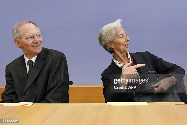 French Finance Minister Christine Lagarde gestures next to her German counterpart Wolfgang Schaeuble during a press conference in Berlin on March 31,...