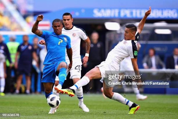 Douglas Costa of Brazil is challenged by Oscar Duarte of Costa Rica during the 2018 FIFA World Cup Russia group E match between Brazil and Costa Rica...