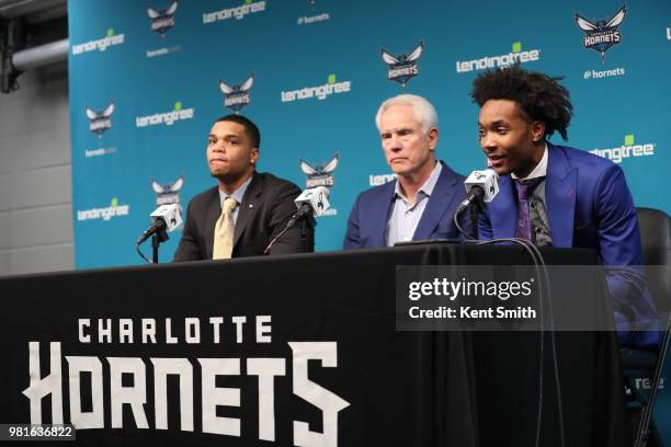 Draft Picks Miles Bridges and Devonte' Graham look on with General Manager Mitch Kupchak during the Charlotte Hornets Draft press conference in...