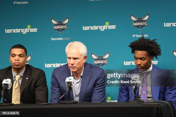 Draft Picks Miles Bridges and Devonte' Graham look on with General Manager Mitch Kupchak during the Charlotte Hornets Draft press conference in...