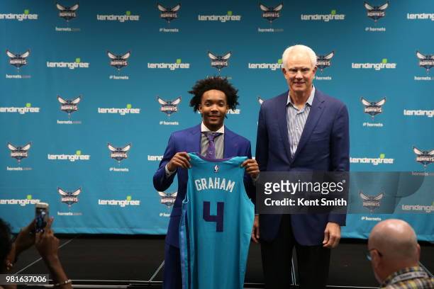 Draft Pick Devonte' Graham and General Manager Mitch Kupchak pose for a photo at the Charlotte Hornets Draft press conference in Charlotte, North...