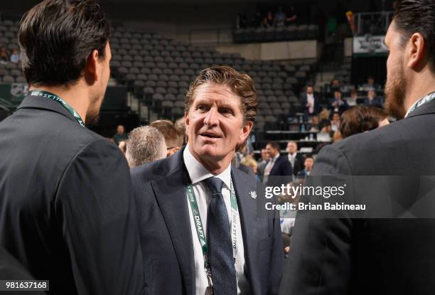 Head Coach Mike Babcock of the Toronto Maple Leafs looks on from the draft floor during the first round of the 2018 NHL Draft at American Airlines...