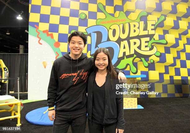 Olympian Ice Dancers Alex Shibutani and Maia Shibutani at Nickelodeon's booth at 2018 VidCon at Anaheim Convention Center on June 22, 2018 in...