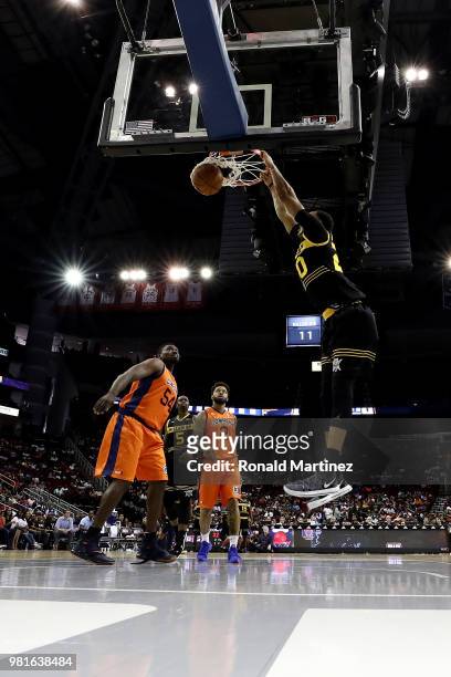 Ryan Hollins of Killer 3s dunks against the 3's Company during week one of the BIG3 three on three basketball league at Toyota Center on June 22,...