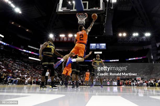 Andre Emmett of 3's Company goes up for a layup during a game against the Killer 3s during week one of the BIG3 three on three basketball league at...