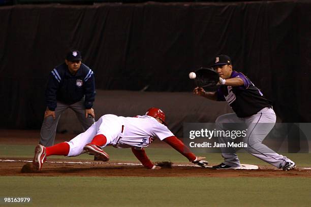 Mario Valenzuela of Red Devils and Francisco Mendez of Dorados during their match as part of the 2010 Baseball Mexican League Tournament at Sol...