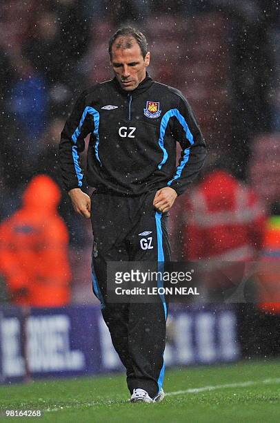 West Ham's Italian manager Gianfranco Zola leaves the field after their 0-1 defeat in the English Premier League football match between West Ham...