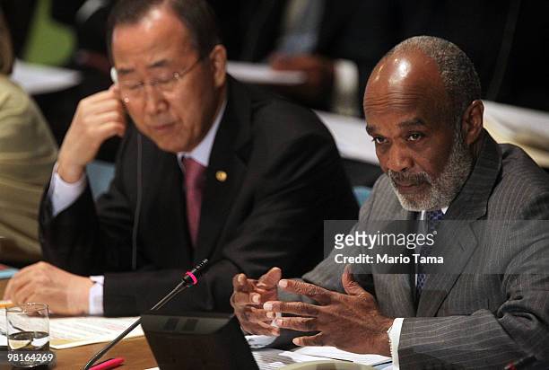 Haitian President Rene Garcia Preval speaks as U.N. Secretary-General Ban Ki-moon looks on during the opening session of the "International Donors'...