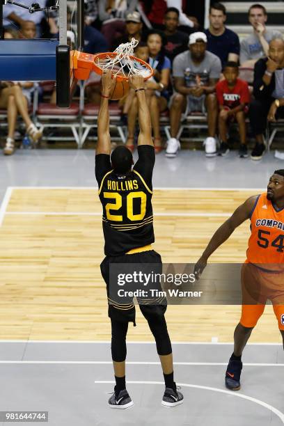 Ryan Hollins of Killer 3s dunks against Jason Maxiell of 3's Company during week one of the BIG3 three on three basketball league at Toyota Center on...