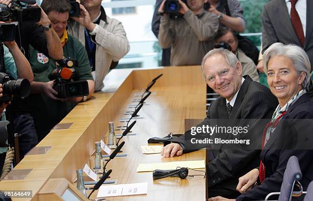 Wolfgang Schaeuble, Germany's finance minister, second from right, and Christine Lagarde, France's finance minister, right, arrive for a news...