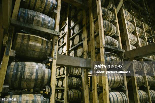 Febuary 2018, USA, Lynchburg: Barrels of the whiskey producer Jack Daniel's stacked in one of the barrel houses. Company founder Jack Daniel...