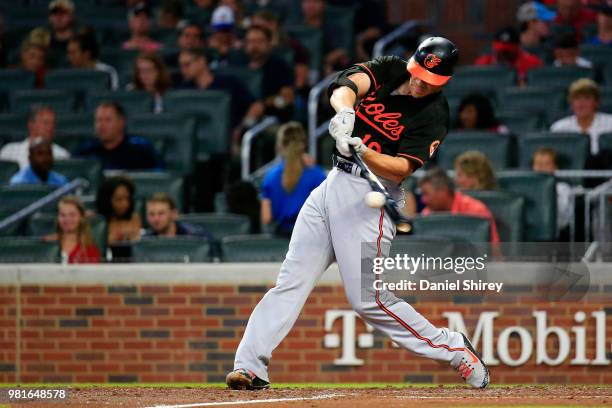 Chris Davis of the Baltimore Orioles hits a solo home run during the fifth inning against the Atlanta Braves at SunTrust Park on June 22, 2018 in...