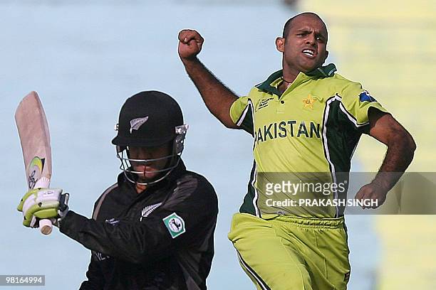 In this picture taken on October 25 Pakistan cricketer Rana Naved-Ul-Hasan celebrates the wicket of New Zealand cricketer Nathan Astle during their...