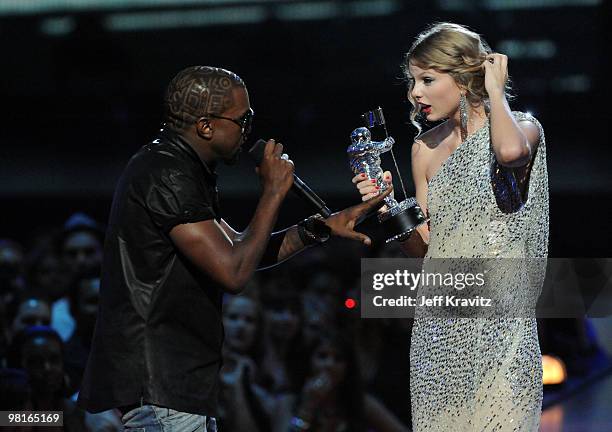 Kayne West jumps onstage as Taylor Swift accepts her award for the "Best Female Video" award during the 2009 MTV Video Music Awards at Radio City...
