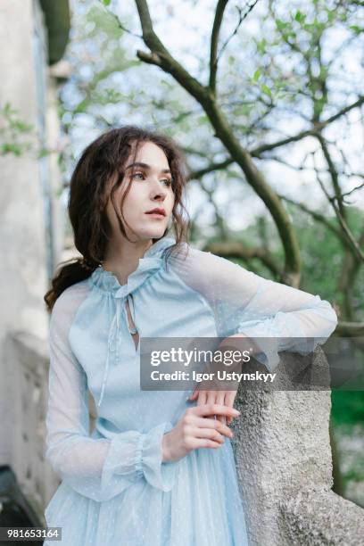 young woman resting in public park - リヴィウ ストックフォトと画像