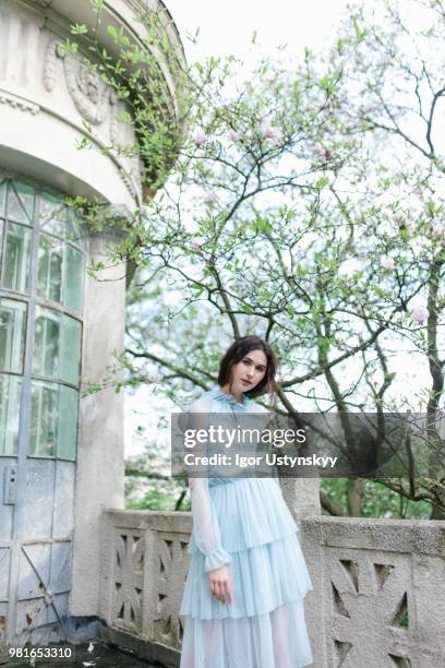 young woman resting in public park - リヴィウ ストックフォトと画像