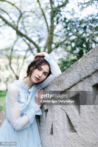 young woman resting in public park - リヴィウ ストックフォトと画像